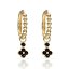 Aros de Oro 18K con Flor y Circonitas Negras – Detalle Chic con Actitud